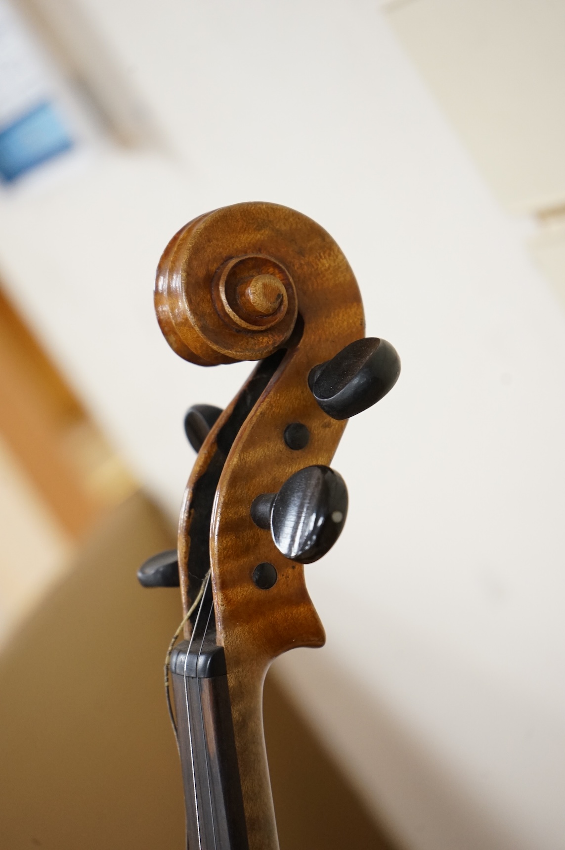 Four violins; a German Dresden violin, together with further two German violins, and a Saxony violin, three in cases or the remains of cases.